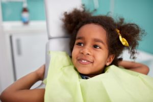 little girl smiling in dental chair tongue tie treatment dentist in Knoxville Tennessee